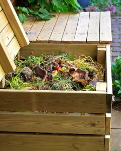 Compost bins made ​​of wood for vegetable kitchen and garden waste.